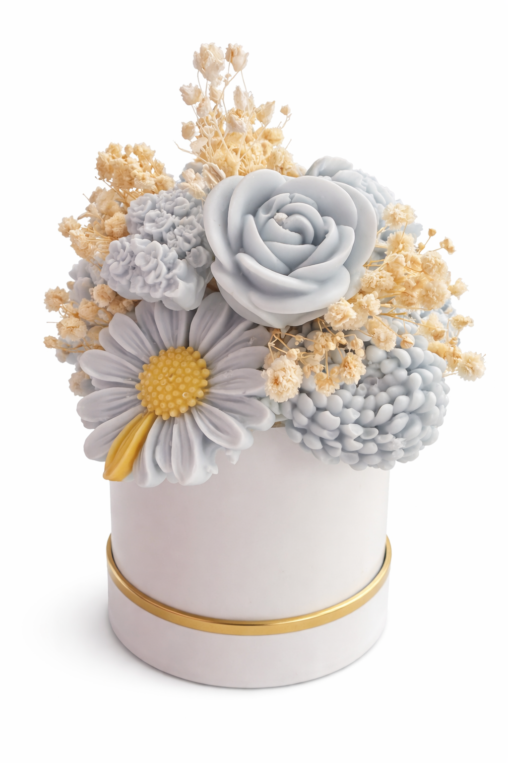 Decorative flower arrangement in a white container with gold accent on a white background