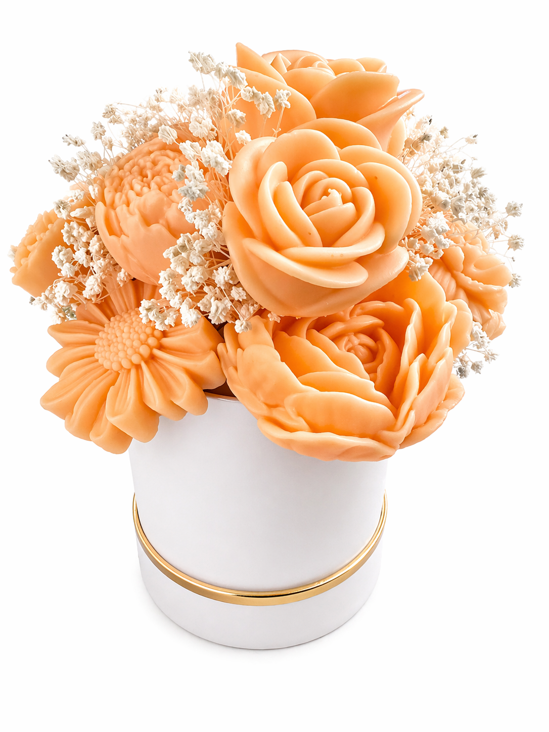 Bouquet of peach-colored flowers in a white vase with gold rim on a white background