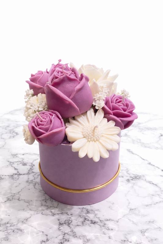 Candle Bouquet (With Wick)$10 Off – Minor Imperfections featuring handcrafted purple and white floral soy wax candles in a round lavender box