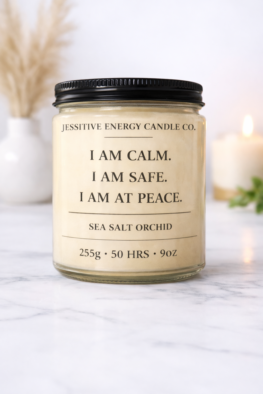 Candle with a label on a marble surface