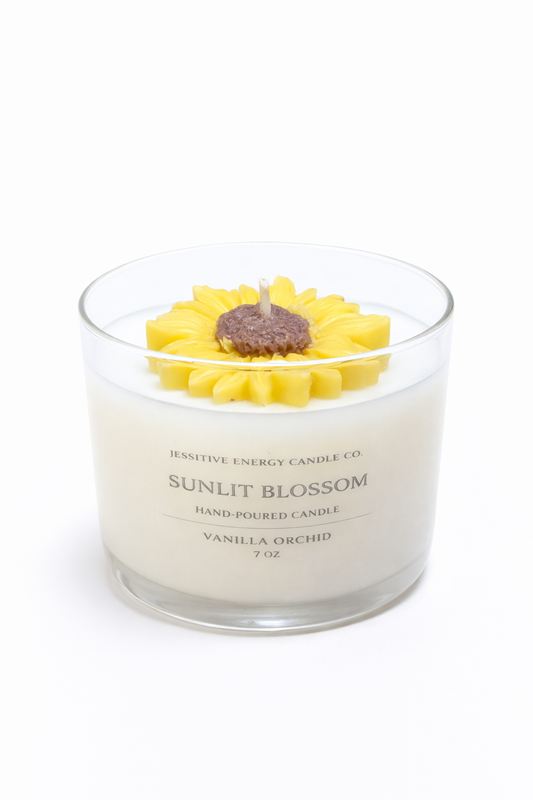 Sunlit Blossom candle with sunflower design on top against a white background