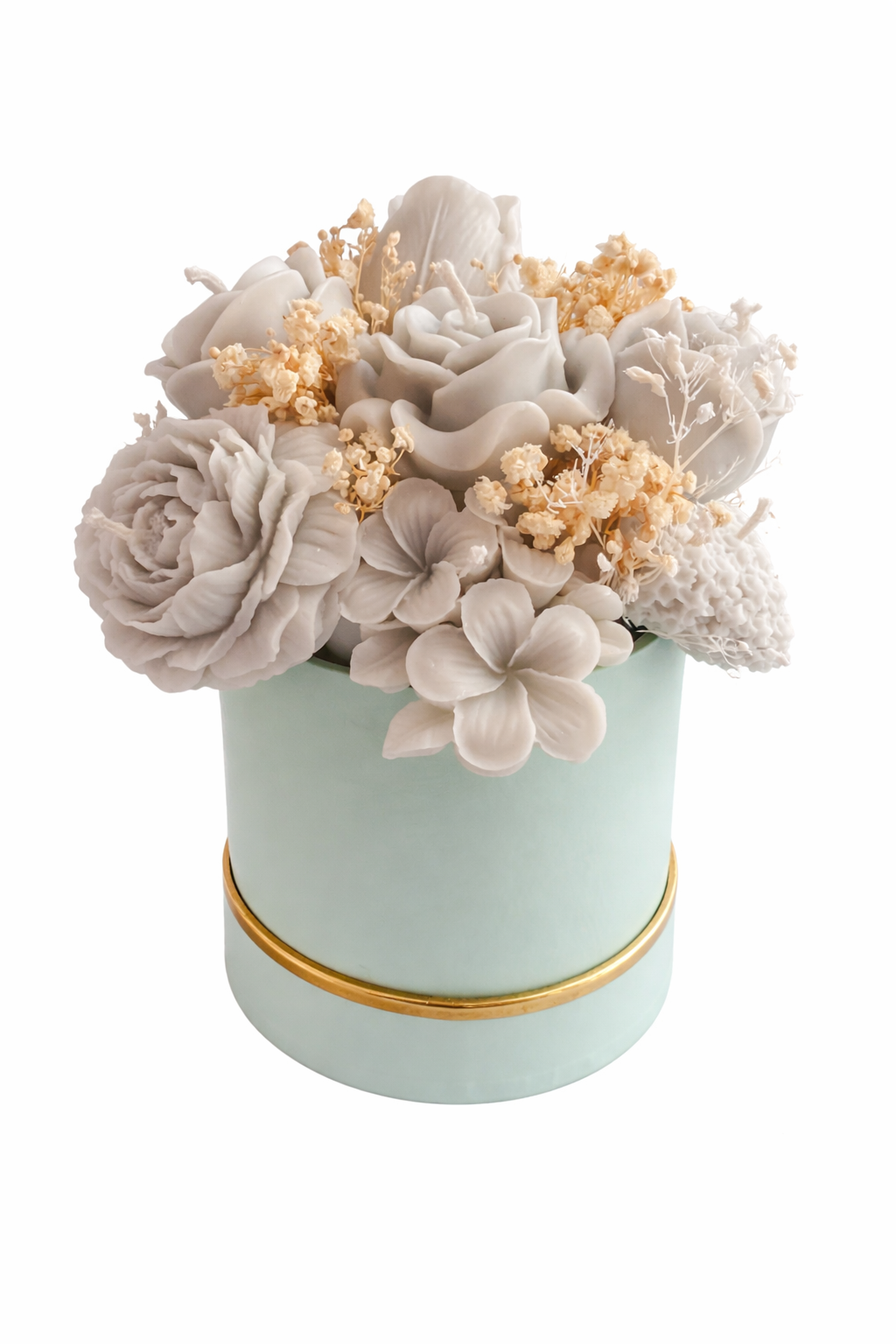 Decorative flower arrangement in a light blue pot with gold rim on a white background