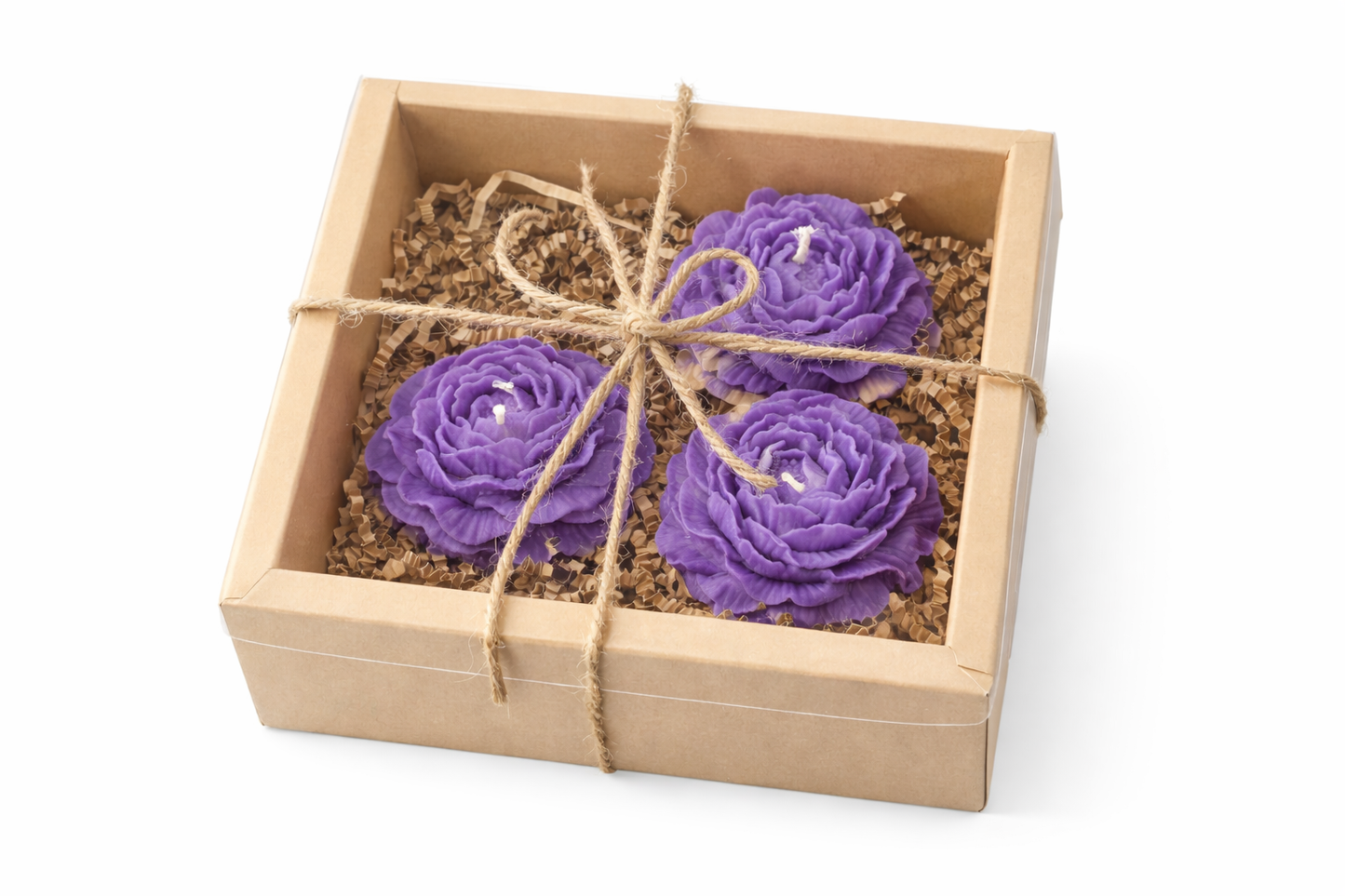 Three purple rose-shaped candles in a wooden box with twine